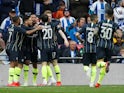 Manchester City players celebrate the opening goal against Brighton in their FA Cup semi-final on April 6, 2019