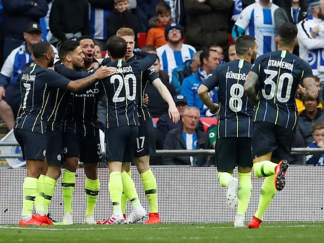 Manchester City players celebrate the opening goal against Brighton in their FA Cup semi-final on April 6, 2019