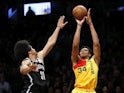 Milwaukee Bucks forward Giannis Antetokounmpo (34) shoots the ball over Brooklyn Nets center Jarrett Allen (31) during the second half at Barclays Center on April 2, 2019