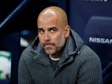 Manchester City manager Pep Guardiola watches on during his side's Premier League clash with Cardiff City on April 3, 2019