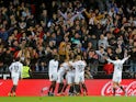 Valencia's Goncalo Guedes celebrates scoring their first goal against Real Madrid with teammates on April 3, 2019