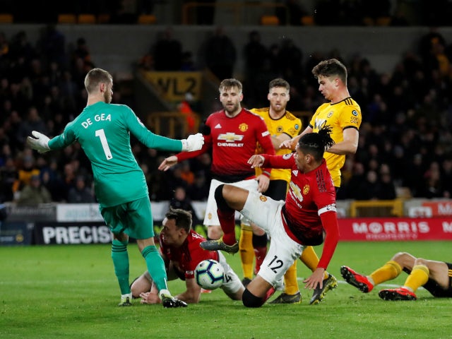 Manchester United's Chris Smalling scores an own goal against Wolverhampton Wanderers in the Premier League on April 2, 2019.