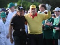 Honorary starters Jack Nicklaus of the U.S. and Gary Player of South Africa (L) arrive for the ceremonial start on the first day of play at the 2019 Master golf tournament at the Augusta National Golf Club in Augusta on April 11, 2019