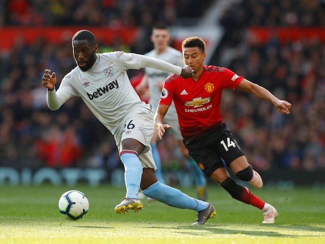 Manchester United's Jesse Lingard in action with West Ham United's Arthur Masuaku in the Premier League on April 13, 2019
