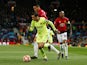Barcelona's Philippe Coutinho runs away from Manchester United's Chris Smalling in the Champions League on April 10, 2019