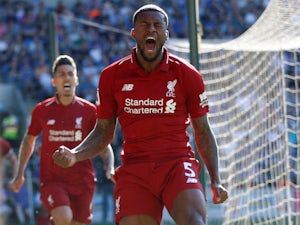 Record-breaking Liverpool regain top spot with Cardiff win