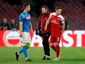 Arsenal midfielder Aaron Ramsey hobbles off the field with a hamstring injury during the Europa League clash with Napoli on April 18, 2019