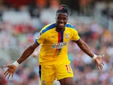 Wilfried Zaha celebrates putting his side back ahead during the Premier League game between Arsenal and Crystal Palace on April 21, 2019