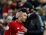 Liverpool manager Jurgen Klopp with Alex Oxlade-Chamberlain as he prepares to come on against Huddersfield on April 26, 2019
