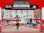 Kenya's Eliud Kipchoge celebrates winning the men's elite race at the 2019 London Marathon on April 28, 2019