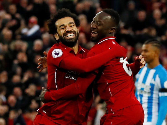 Naby Keita celebrates scoring with Mohamed Salah during the Premier League game between Liverpool and Huddersfield Town on April 26, 2019