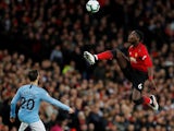 Manchester United midfielder Paul Pogba gets to the ball ahead of Manchester City's Bernardo Silva on April 24, 2019