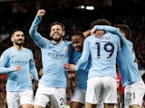 Manchester City players celebrate scoring their second goal against Manchester United on April 24, 2019