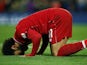 Mohamed Salah kisses the ground after making it five during the Premier League game between Liverpool and Huddersfield Town on April 26, 2019