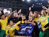 Norwich City players celebrate promotion to the Premier League on April 27, 2019