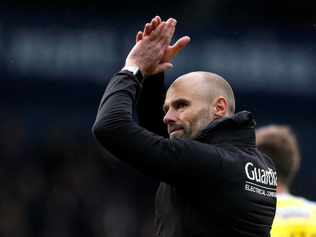 Rotherham boss Paul Warne applauds the fans after their relegation is confirmed on April 27, 2019