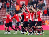 Southampton players celebrate their survival after drawing with Bournemouth on April 27, 2019