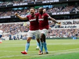 Michail Antonio celebrates with Robert Snodgrass after making the breakthrough during the Premier League game between Tottenham Hotspur and West Ham United on April 27, 2019