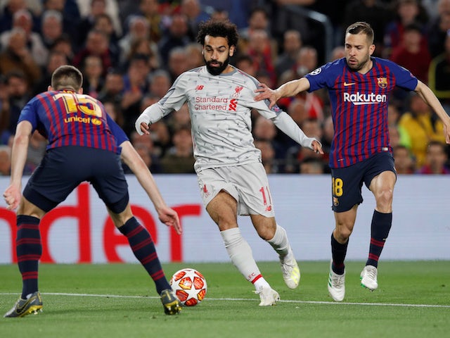 Liverpool's Mohamed Salah in action with Barcelona's Clement Lenglet and Jordi Alba on May 1, 2019