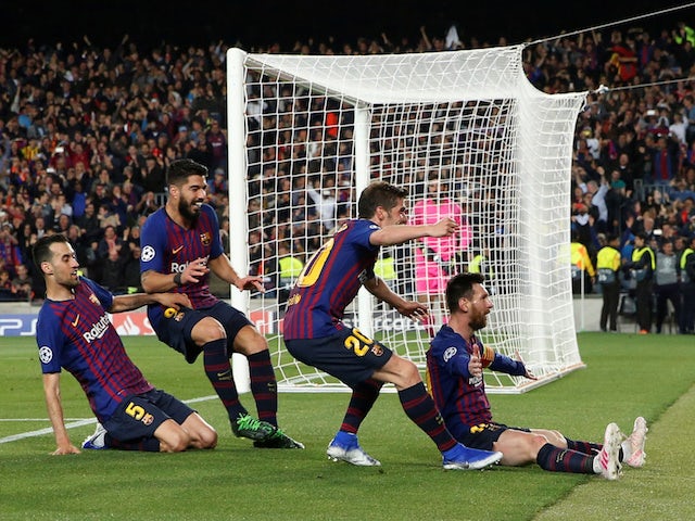 Barcelona players celebrate with Lionel Messi during the Champions League semi-final against Liverpool on May 1, 2019