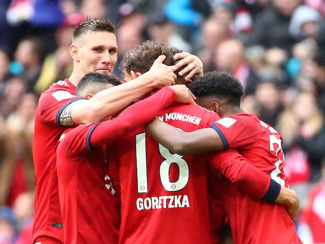 Bayern Munich's Leon Goretzka celebrates scoring their second goal with Niklas Sule and team mates on May 4, 2019