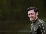 Mesut Ozil flashes a smile during Arsenal training on May 1, 2019