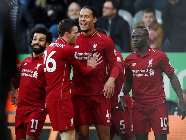 Liverpool defender Virgil van Dijk celebrates scoring with teammates against Newcastle on May 4, 2019