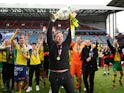 Norwich City celebrate promotion back to the Premier League as champions of the Championship on May 5, 2019