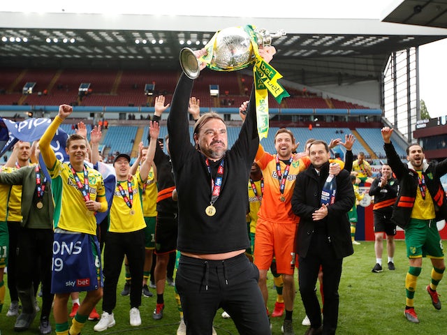 Norwich City celebrate promotion back to the Premier League as champions of the Championship on May 5, 2019