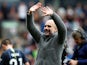 Pep Guardiola celebrates with Manchester City's travelling supporters following the win at Burnley on April 28, 2019
