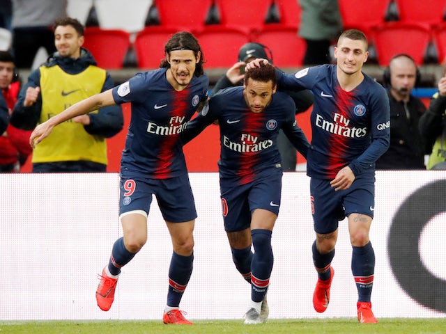 Paris St Germain's Neymar celebrates scoring their first goal with Edinson Cavani and Marco Verratti on May 4, 2019