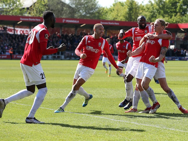 Salford City's Carl Piergianni celebrates scoring their first goal against Eastleigh with teammates on May 5, 2019