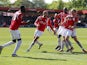Salford City's Carl Piergianni celebrates scoring their first goal against Eastleigh with teammates on May 5, 2019
