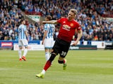 Scott McTominay celebrates scoring during the Premier League game between Huddersfield Town and Manchester United on May 5, 2019
