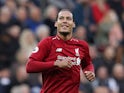 Liverpool defender Virgil van Dijk celebrates scoring against Newcastle on May 4, 2019