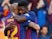 Barcelona's Samuel Umtiti hugs teammate Arturo Vidal during the team's La Liga clash with Getafe on May 12, 2019