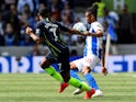 Manchester City's Raheem Sterling battles Brighton & Hove Albion's Bernardo for the ball in the Premier League on May 12, 2019