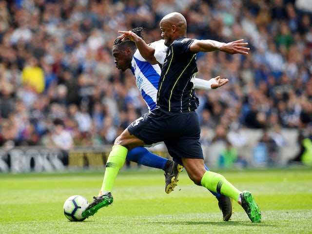 Manchester City's Vincent Kompany in action with Brighton & Hove Albion's Yves Bissouma in the Premier League on May 12, 2019