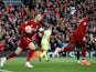 Jordan Henderson and Divock Origi after Liverpool score against Barcelona in the Champions League on May 7, 2019.