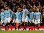 Vincent Kompany celebrates with teammates after firing in the opener during the Premier League game between Manchester City and Leicester City on May 6, 2019