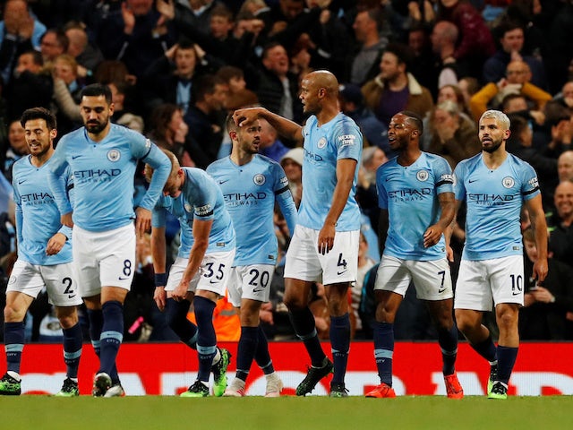 Vincent Kompany celebrates with teammates after firing in the opener during the Premier League game between Manchester City and Leicester City on May 6, 2019