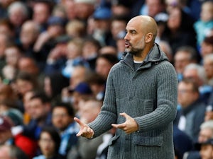 Pep Guardiola gives instructions during the Premier League game between Manchester City and Leicester City on May 6, 2019