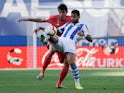 Real Madrid's Jesus Vallejo in action with Real Sociedad's Willian Jose on May 12, 2019