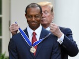 Donald Trump puts a medal around the neck of Tiger Woods on May 6, 2019