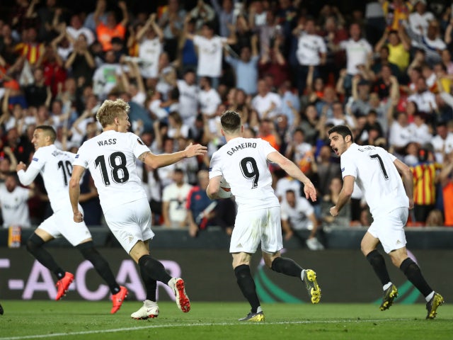 Valencia's players celebrate Kevin Gameiro's early goal against Arsenal in their Europa League semi-final second leg on May 9, 2019