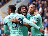 Arsenal's Pierre-Emerick Aubameyang celebrates with Mohamed Elneny and Joe Willock after scoring their first goal on May 12, 2019