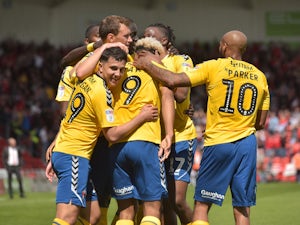 Charlton Athletic's Lyle Taylor celebrates scoring their first goal with teammates against Concaster on May 12, 2019