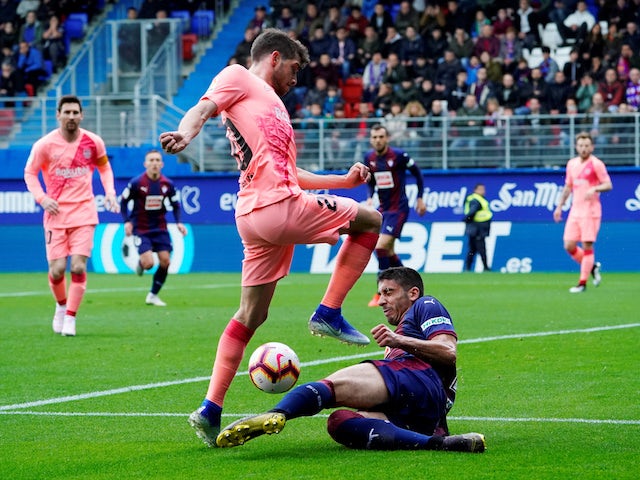 Barcelona's Sergi Roberto is challenged by Eibar's Jose Angel in La Liga on May 19, 2019
