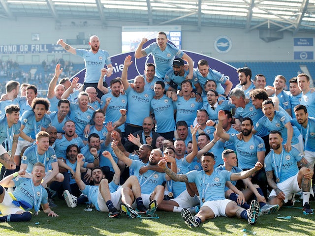 Manchester City players and staff celebrate winning the Premier League title on May 12, 2019