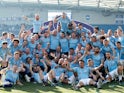 Manchester City players and staff celebrate winning the Premier League title on May 12, 2019